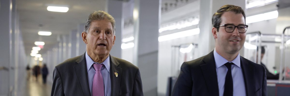 Sen. Joe Manchin walks with chief of staff Lance West