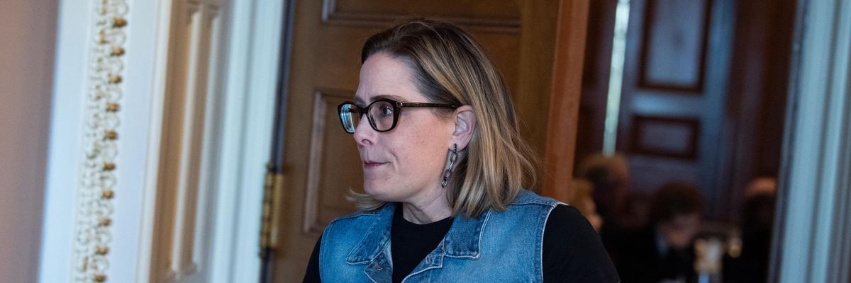 Sen. Kyrsten Sinema leaves a Democratic luncheon