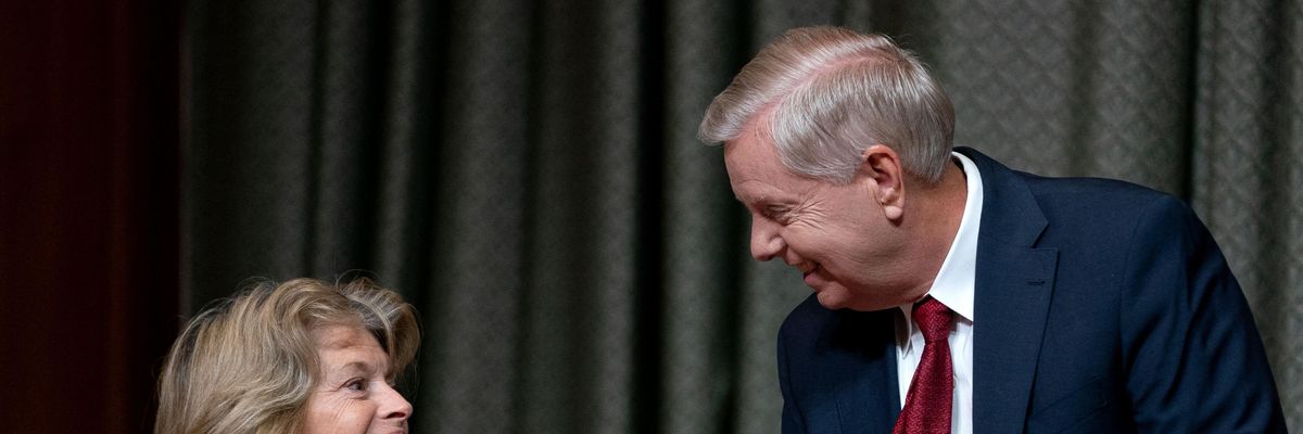 Sen. Lisa Murkowski talks to Sen. Lindsey Graham