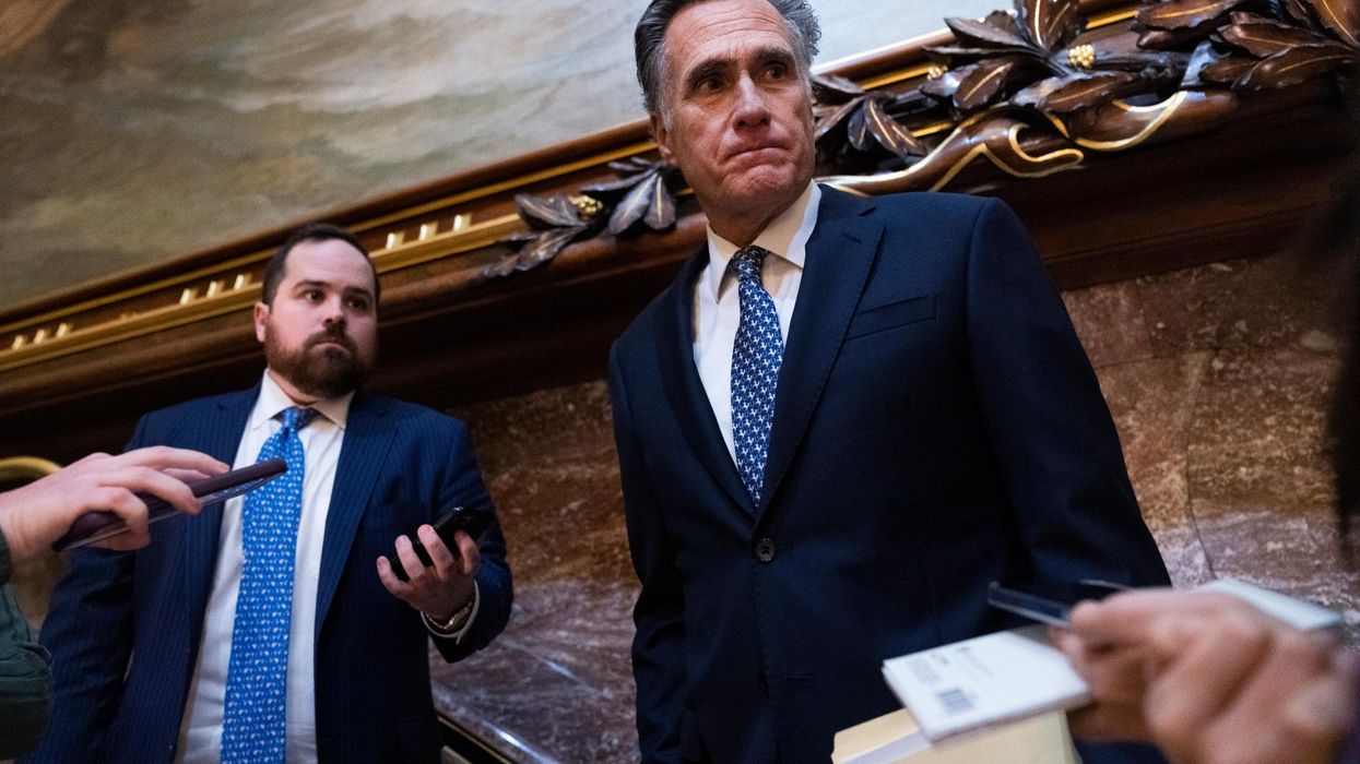 Sen. Mitt Romney speaks to reporters