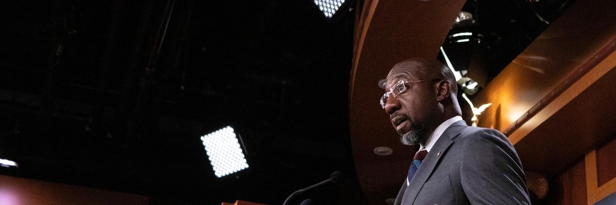 Sen. Raphael Warnock speaks at a press conference