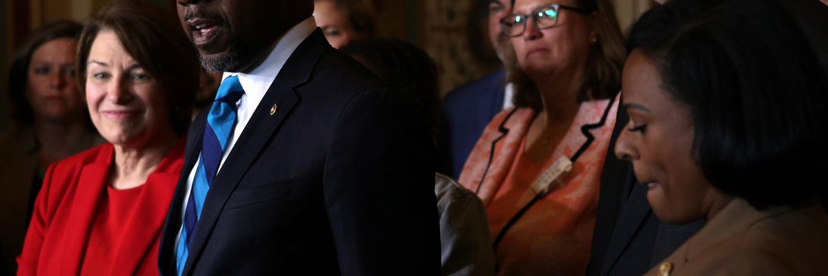 Sen. Raphael Warnock speaks to reporters