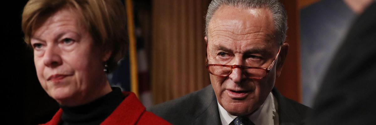 Sen. Tammy Baldwin and Senate Majority Leader Chuck Schumer attend a press conference