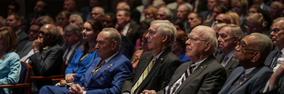 Senate Majority Leader Chuck Schumer and Minority Leader Mitch McConnell watch a speech