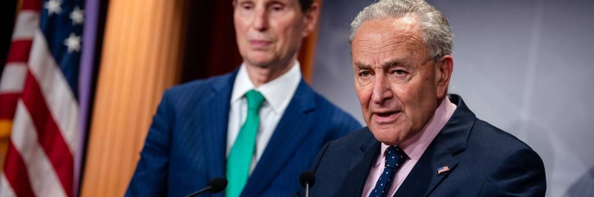Senate Majority Leader Chuck Schumer (D-N.Y.) at a lectern