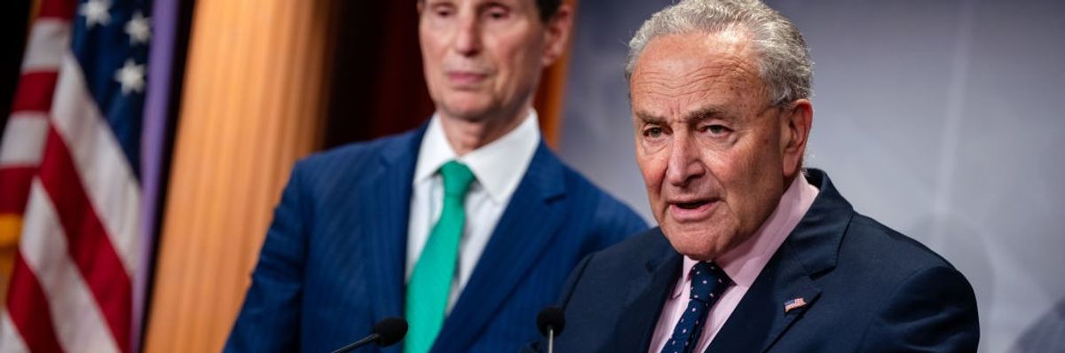 Senate Majority Leader Chuck Schumer (D-N.Y.) at a lectern