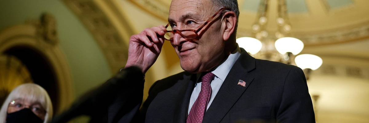 Senate Majority Leader Chuck Schumer speaks to reporters