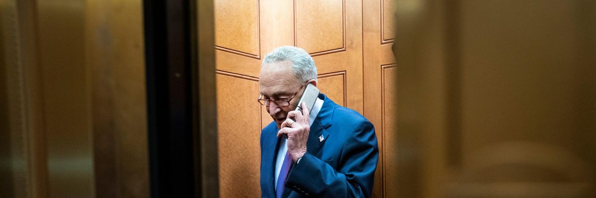 Senate Majority Leader Chuck Schumer talks on the phone.