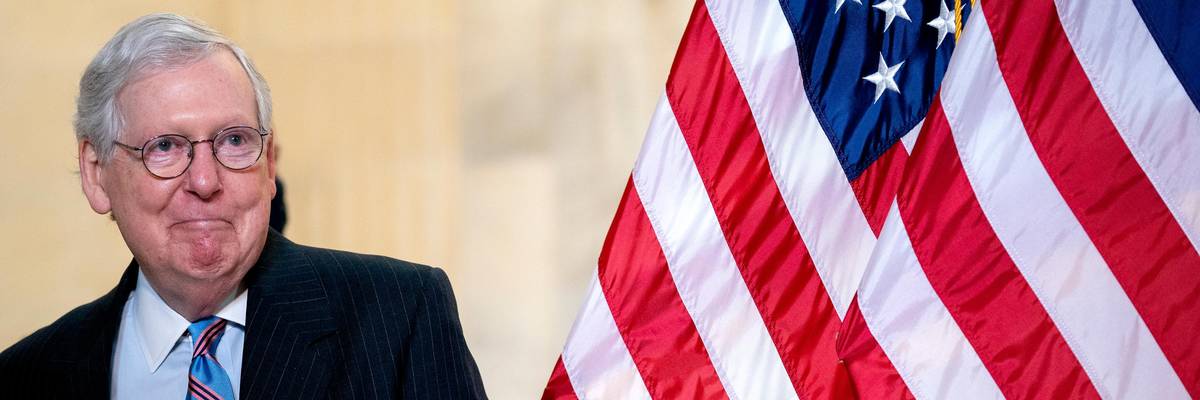 Senate Minority Leader Mitch McConnell arrives at a press briefing