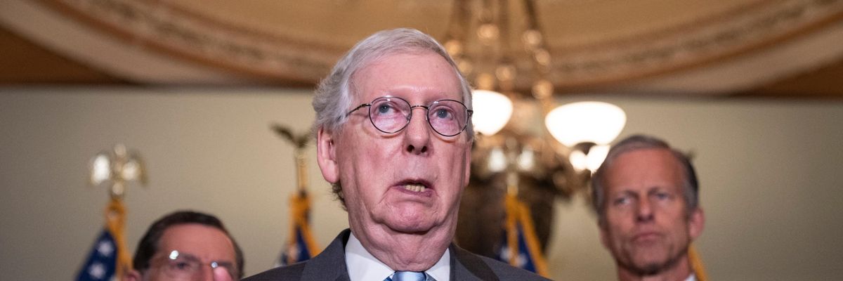 Senate Minority Leader Mitch McConnell speaks to reporters