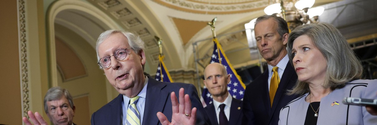 Senate Minority Leader Mitch McConnell speaks to reporters