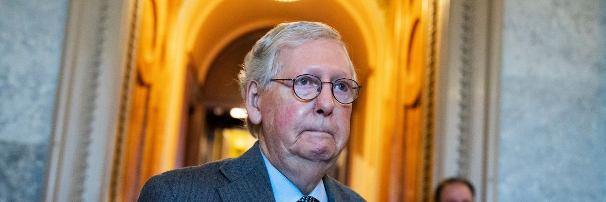 Senate Minority Leader Mitch McConnell walks through the halls of the Senate