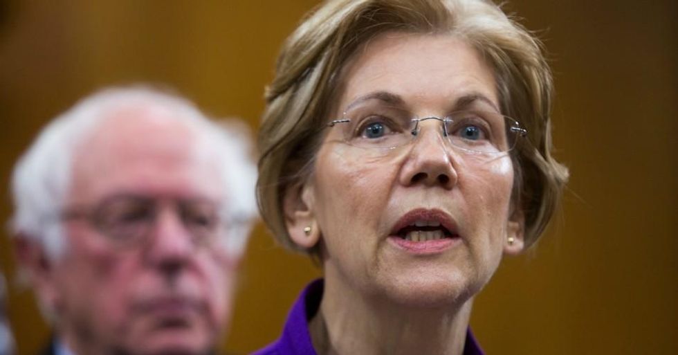 Senator Elizabeth Warren (D-Mass.) attends a news conference with Sen. Bernie Sanders (I-Vt.) on November 28, 2017 in Washington, D.C. Both co-sponsored a resolution opposing Israel's annexation of the West Bank. (Photo by Tasos Katopodis/Getty Images)