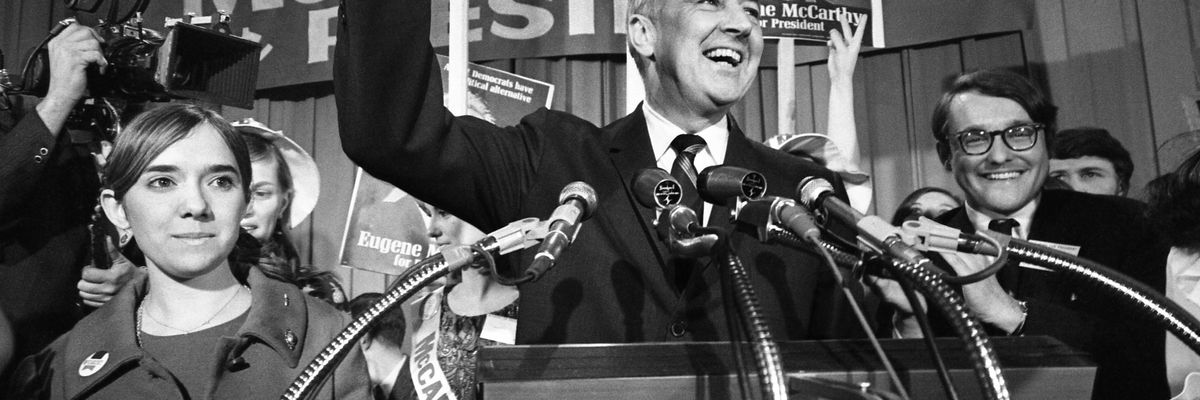 Senator Eugene McCarthy gives a "V" for victory sign 