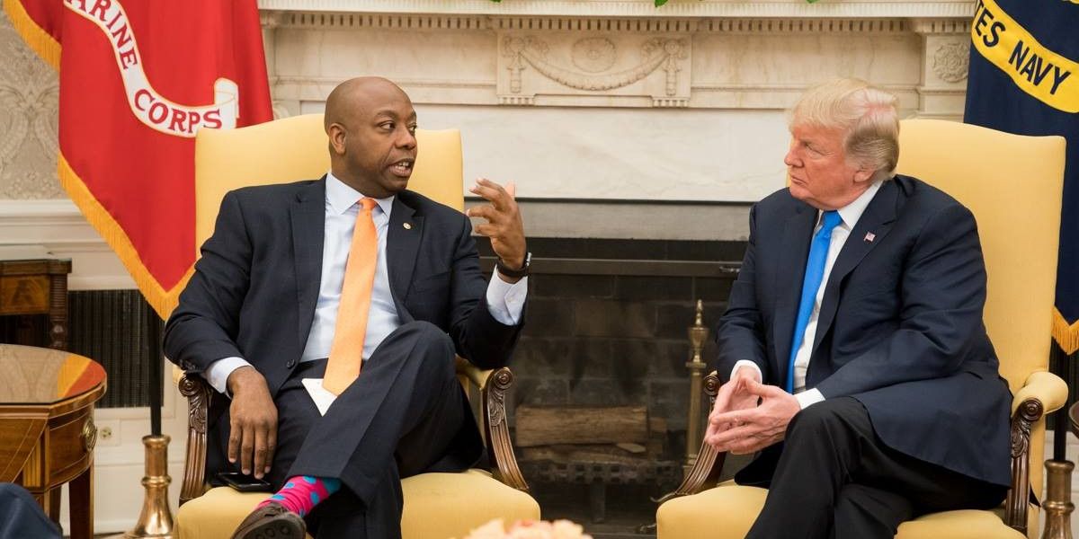 Senator Tim Scott and Donald Trump speak in the White House.