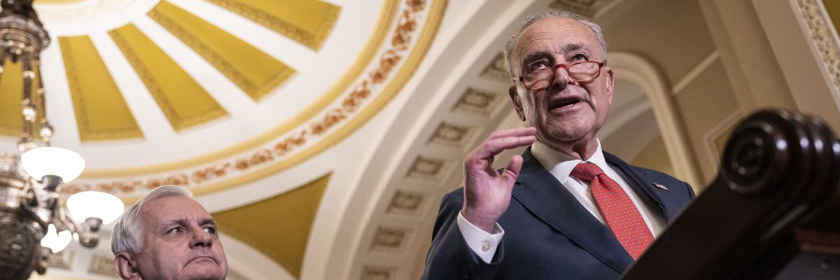 Sens. Jack Reed and Chuck Schumer appear at a press conference