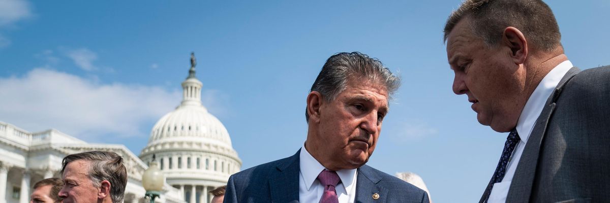 Sens. Joe Manchin and Jon Tester speak during a press conference.