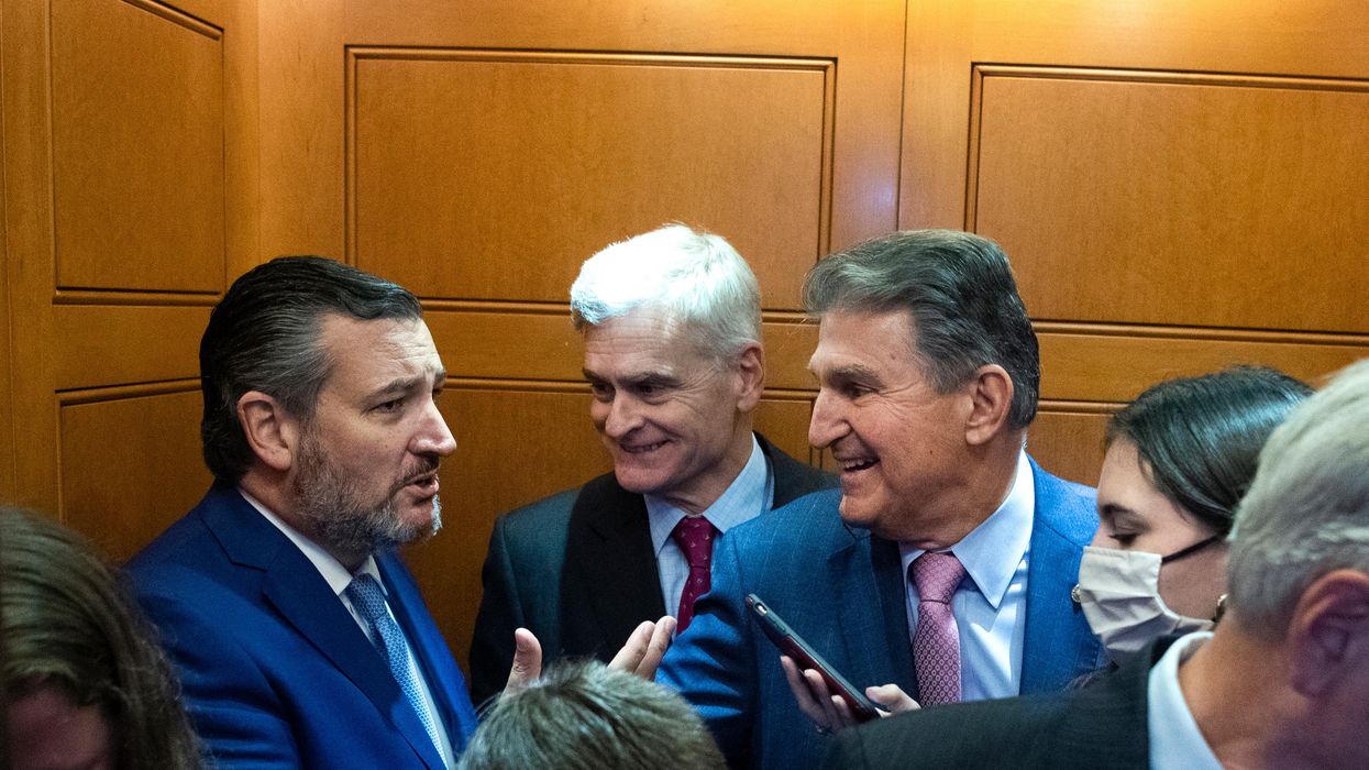 Sens. Ted Cruz (R-Texas), left, and Joe Manchin (D-W.Va.), right, talk during an elevator ride at the U.S. Capitol on September 22, 2021.