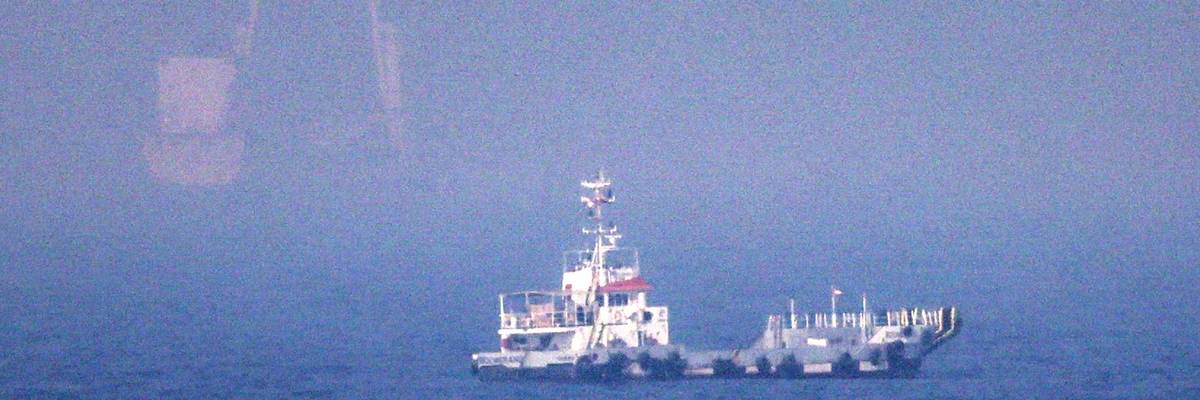 Ships sail near the Strait of Hormuz off the eastern coast of the United Arab Emirates