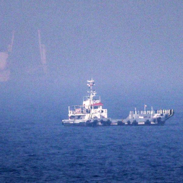 Ships sail near the Strait of Hormuz off the eastern coast of the United Arab Emirates