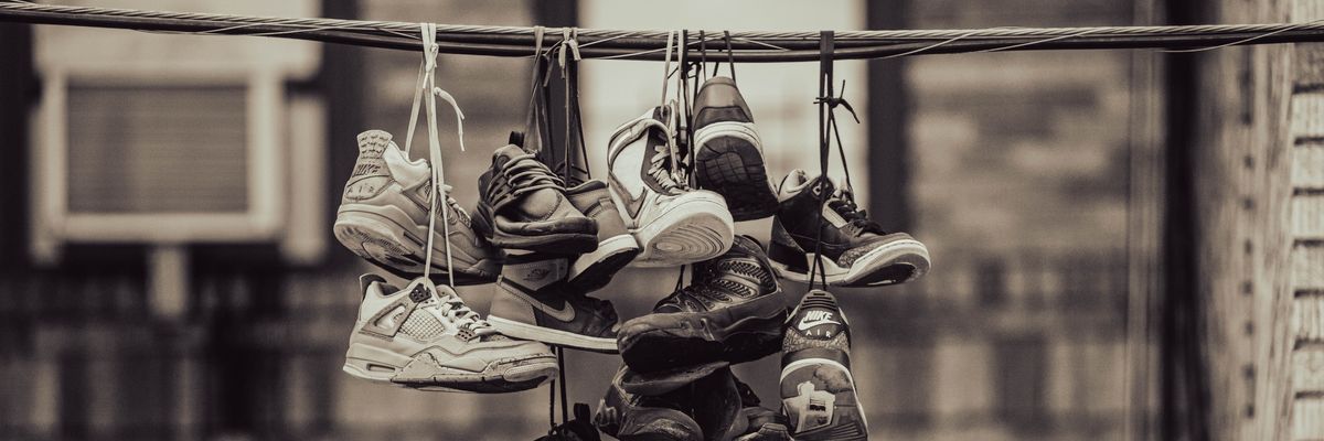 Shoes hanging from a wire