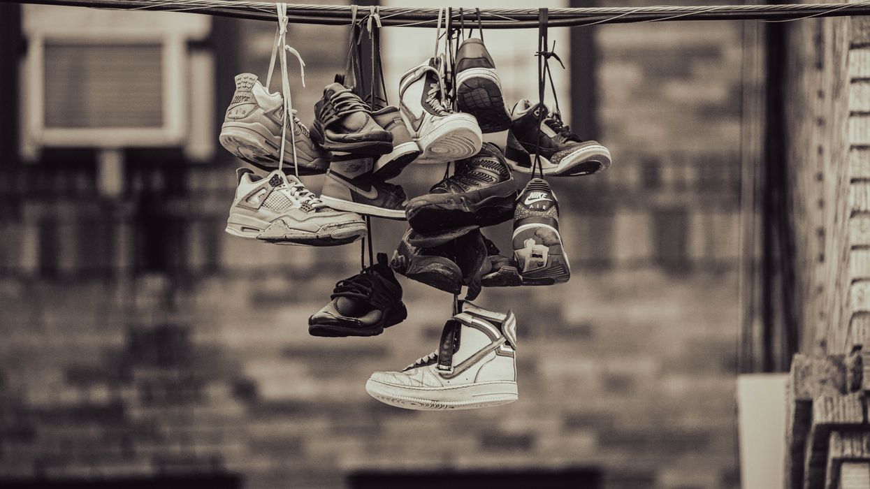 Shoes hanging from a wire