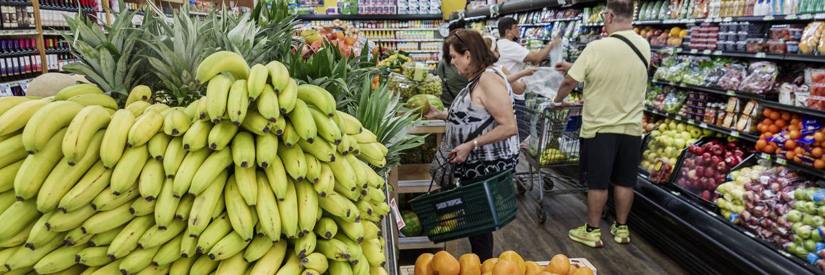 Shoppers browse produce at Sabor Tropical Supermarket