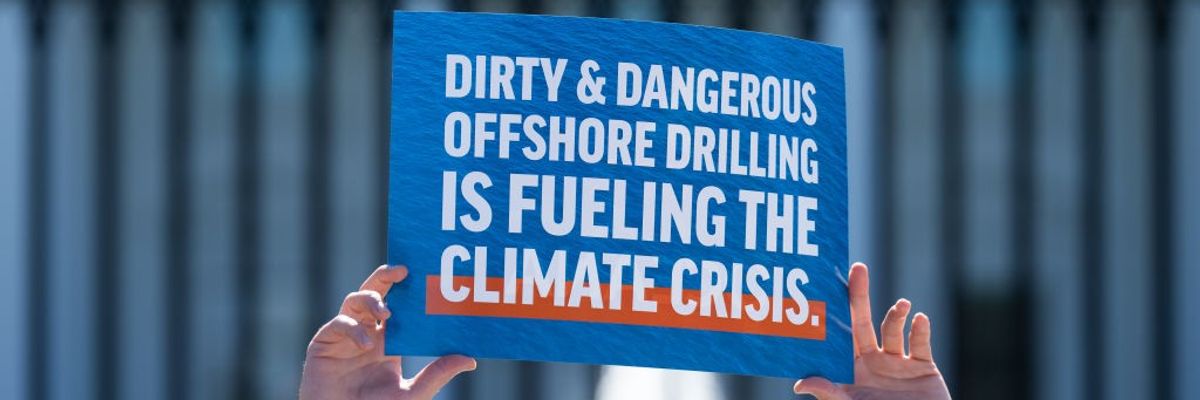 Sign in front of White House says "Dirty & Dangerous Offshore Drilling Is Fueling the Climate Crisis"