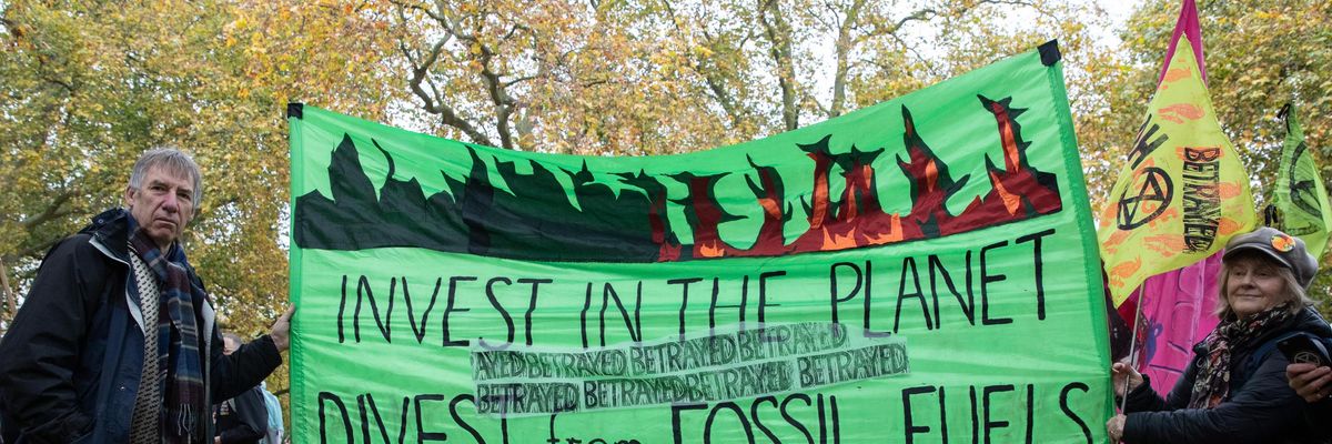 Sign reading, "Invest in the planet, divest from fossil fuels"
