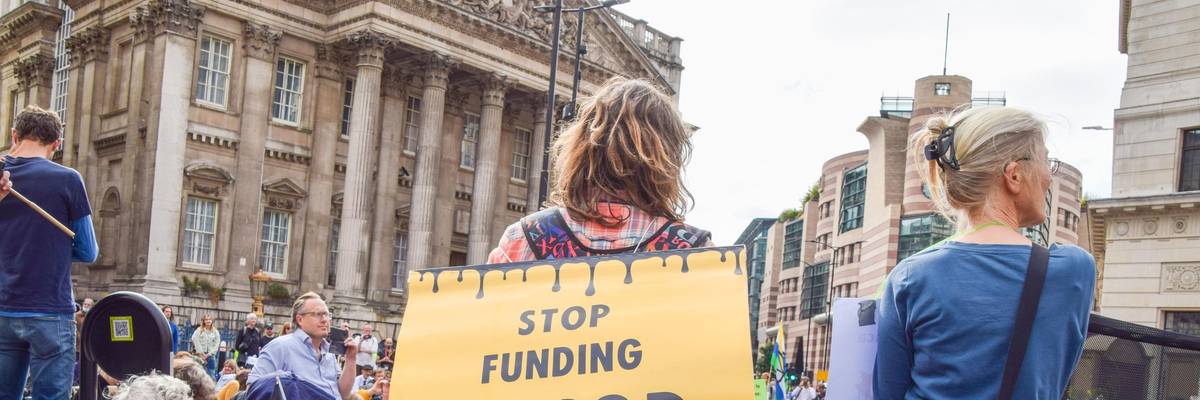 Sign reading, "Stop funding EACOP"