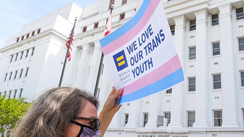Sign reading "We love our trans youth"