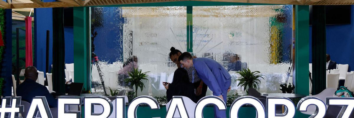 Sign reads "#AFRICACOP27" as UN climate summit kicks off in Egypt