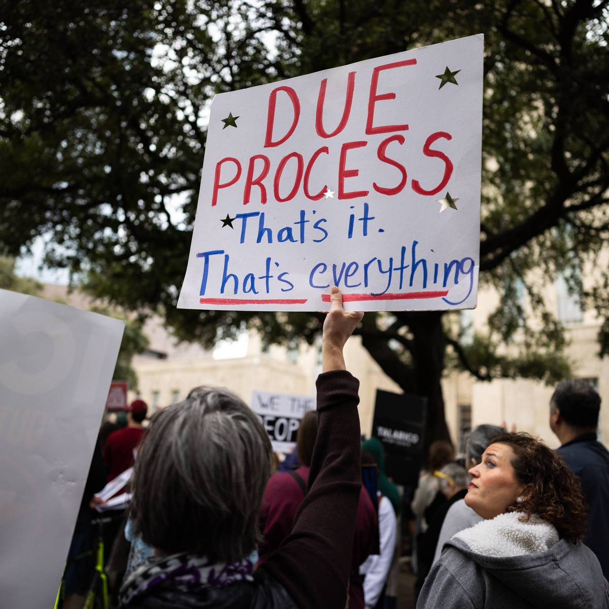 Sign reads, ''Due process: That's it. That's everything.'' during an anti-ICE demonstration at Houston City Hall