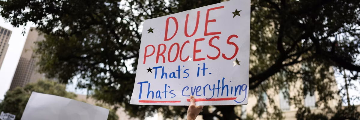 Sign reads, ''Due process: That's it. That's everything.'' during an anti-ICE demonstration at Houston City Hall