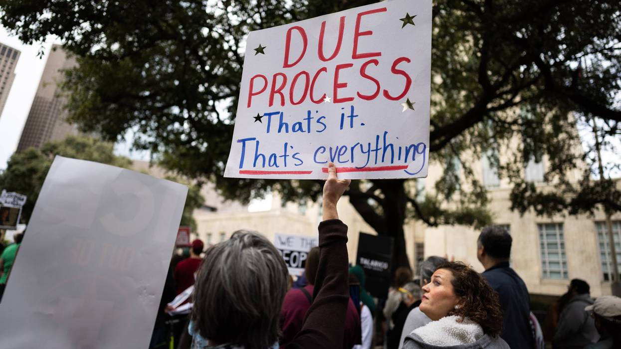 Sign reads, ''Due process: That's it. That's everything.'' during an anti-ICE demonstration at Houston City Hall