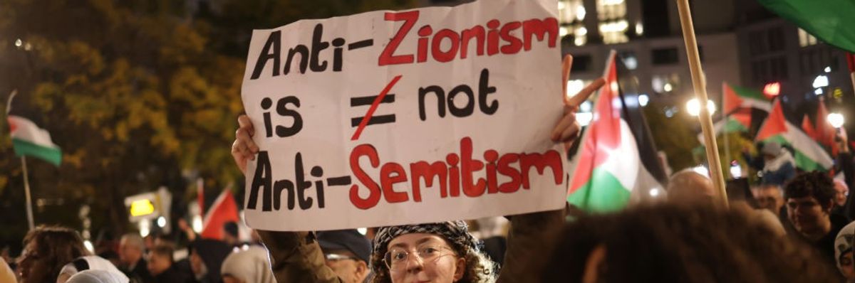 Sign says "Anti-Zionism is Not Anti-Semitism."