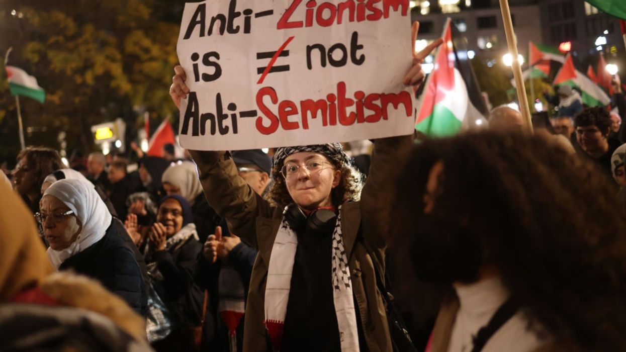 Sign says "Anti-Zionism is Not Anti-Semitism."