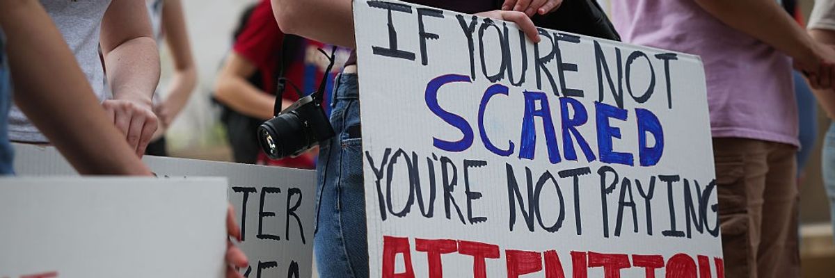 Sign says: "If you're not scared, you're not paying attention."