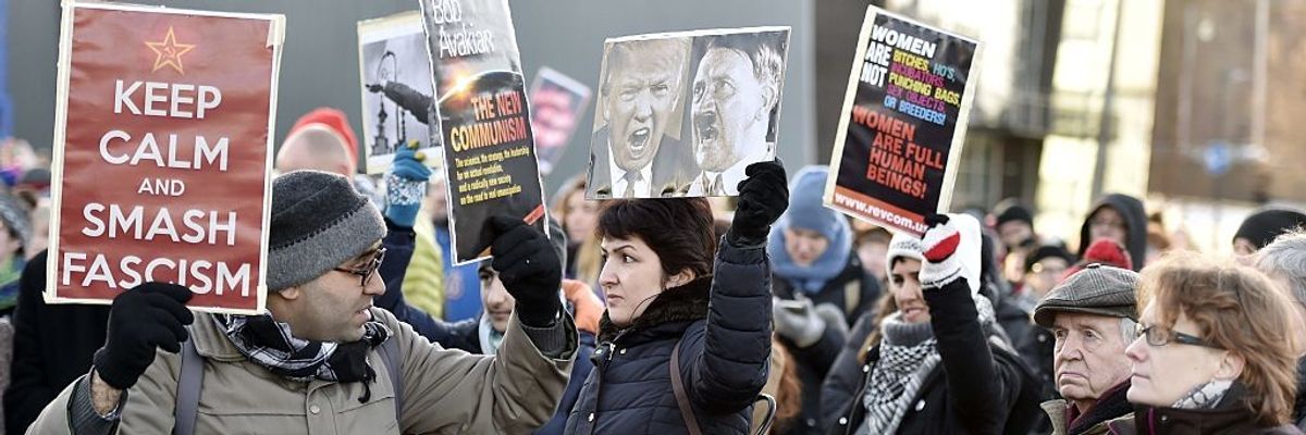 Sign says "Keep calm and Smash Fascism"