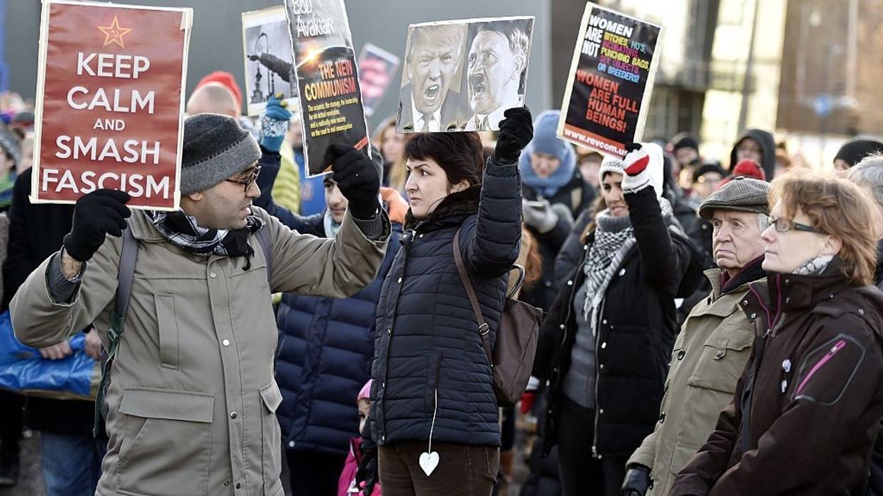 Sign says "Keep calm and Smash Fascism"
