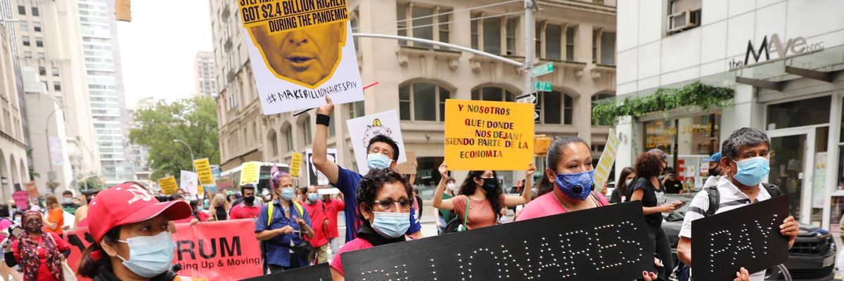 Sign says "Make the Billionaires Pay"