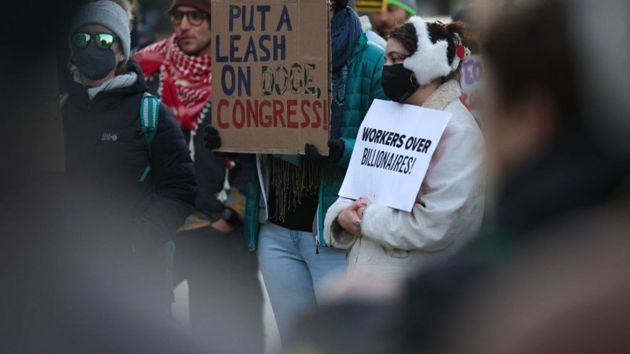 sign says, put a leash on DOGE