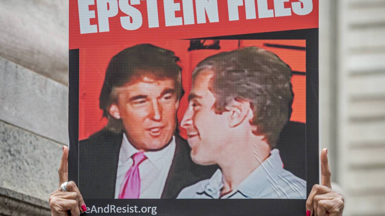 sign says, release the unredacted epstein files
