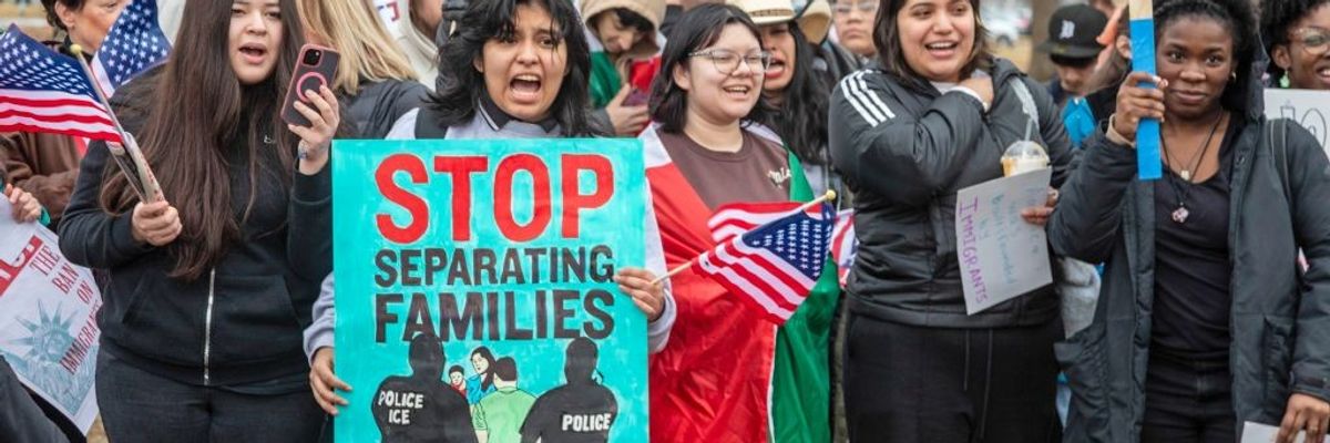 sign says, "Stop separating families"