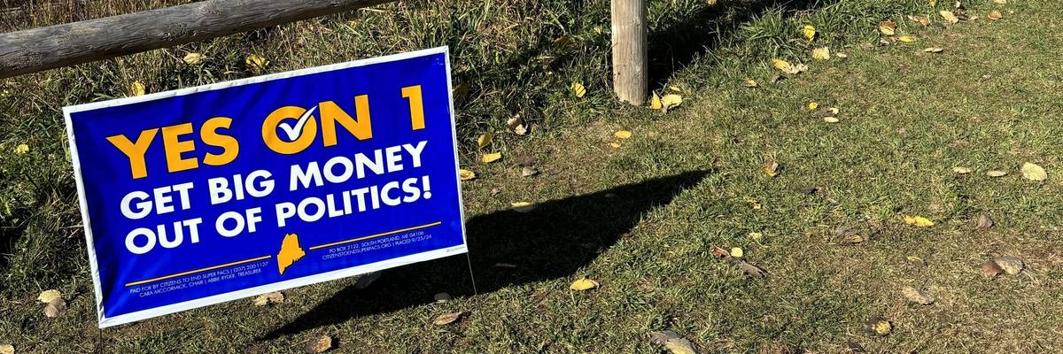 sign says: Yes on 1, get big money out of politics!