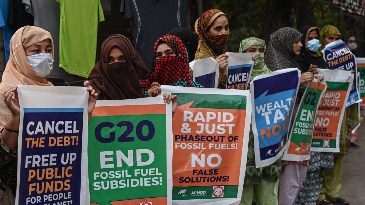 Signs calling for G20 to end fossil fuel subsidies and phase out fossil fuels