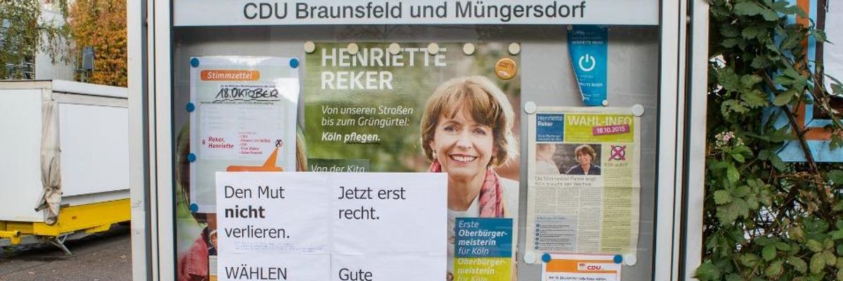 Signs encouraging Henriette Reker to "get well soon"