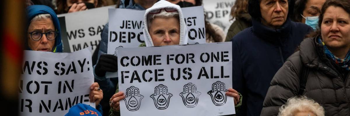 Signs read: "Come for one—Face Us All"