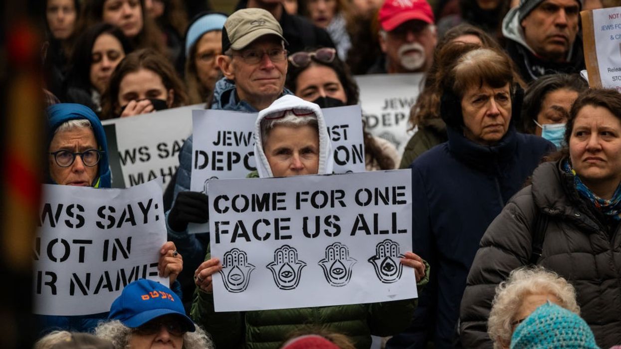 Signs read: "Come for one—Face Us All"