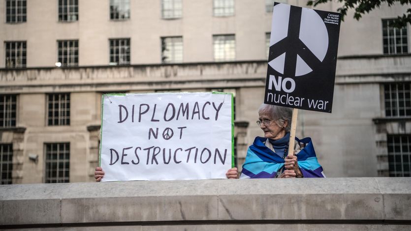 Signs read "Diplomacy Not Destruction" and "No Nuclear War"